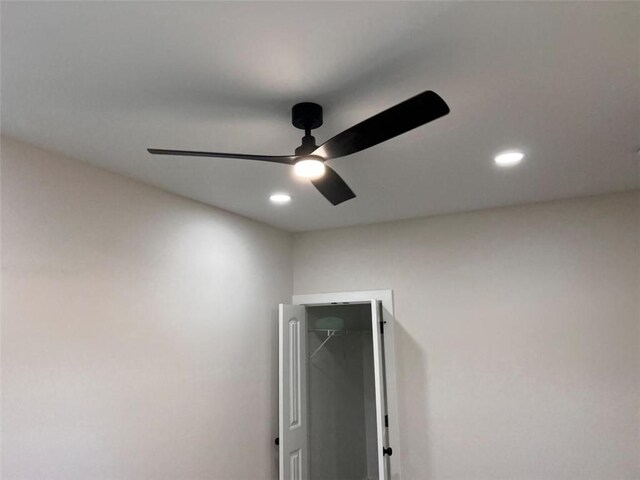 spare room with dark wood-style flooring, crown molding, recessed lighting, ceiling fan, and baseboards