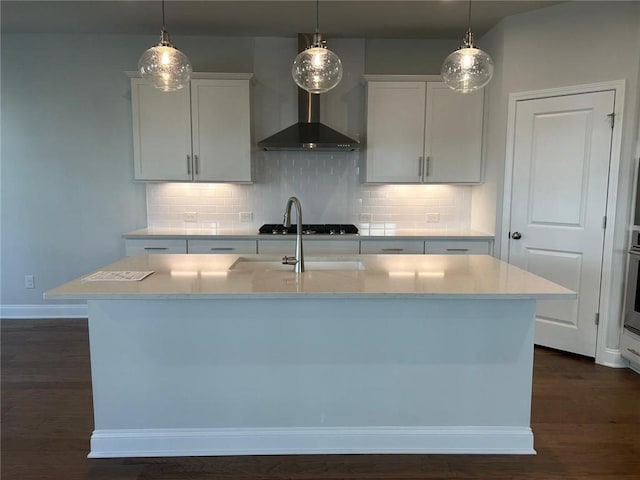 kitchen featuring light countertops, hanging light fixtures, and decorative backsplash