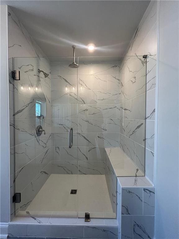 full bathroom featuring a shower stall