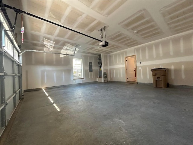 garage featuring electric panel and a garage door opener