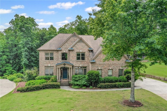 602 Davenport Pl, Canton, GA 30115 - view of front of house with brick siding, a front lawn, and concrete driveway
