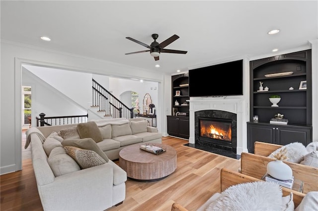 602 Davenport Pl, Canton, GA 30115 - living area featuring ceiling fan, ornamental molding, a fireplace, recessed lighting, and stairs