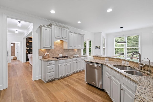 602 Davenport Pl, Canton, GA 30115 - kitchen with stainless steel appliances, a sink, decorative backsplash, light wood-style flooring, and light stone countertops