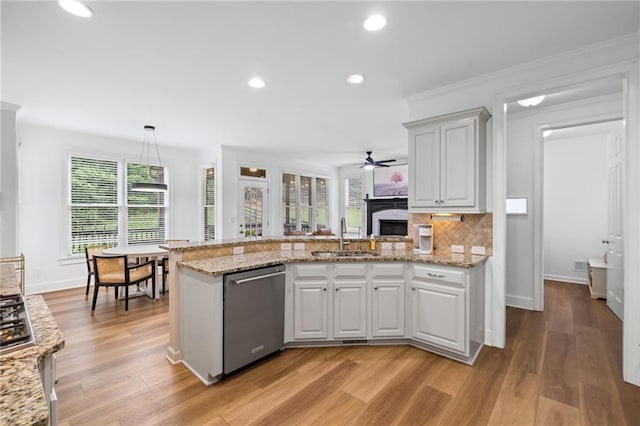 602 Davenport Pl, Canton, GA 30115 - kitchen with dishwasher, a sink, a peninsula, a ceiling fan, and decorative backsplash