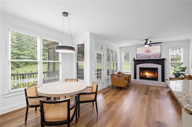 602 Davenport Pl, Canton, GA 30115 - dining area featuring a brick fireplace, ceiling fan, and plenty of natural light