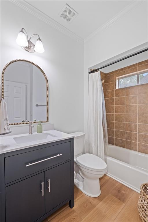 602 Davenport Pl, Canton, GA 30115 - full bath with vanity, wood finished floors, toilet, ornamental molding, and shower / bath combination with curtain