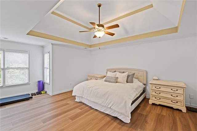 602 Davenport Pl, Canton, GA 30115 - bedroom featuring a raised ceiling, wood finished floors, crown molding, baseboards, and ceiling fan
