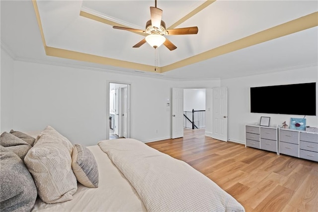 602 Davenport Pl, Canton, GA 30115 - bedroom with a tray ceiling, light wood finished floors, baseboards, a ceiling fan, and ornamental molding
