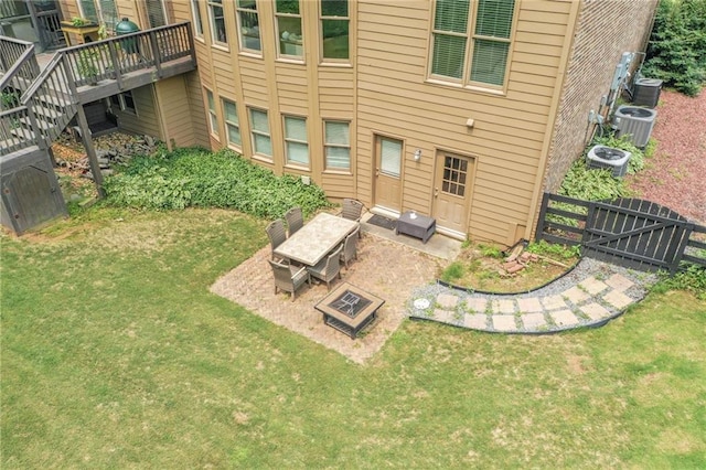 602 Davenport Pl, Canton, GA 30115 - back of property with a deck, a patio, and central AC