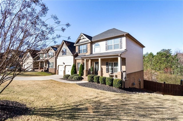 craftsman inspired home with covered porch and a garage