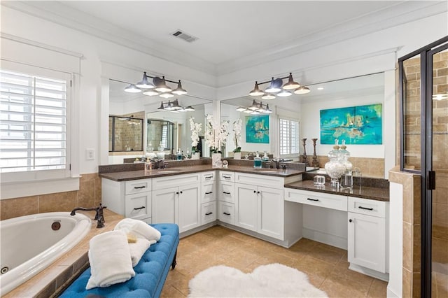 bathroom with tile patterned flooring, vanity, separate shower and tub, and crown molding