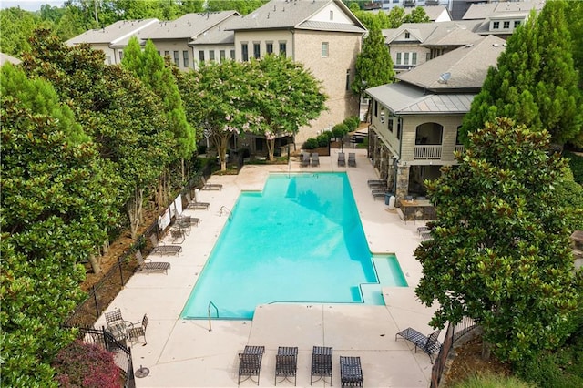 view of swimming pool with a patio area