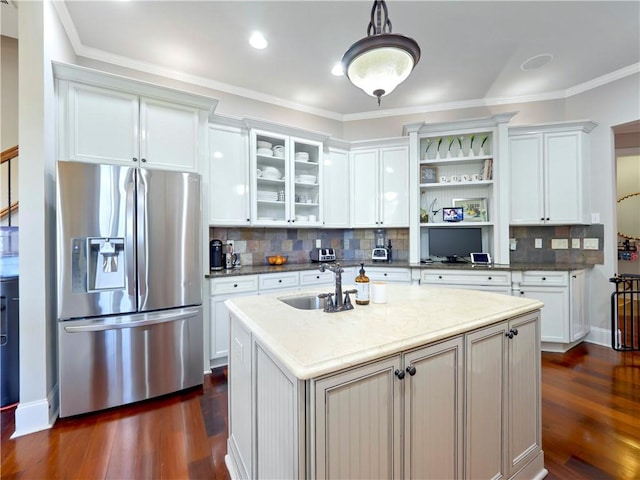kitchen featuring dark wood-style flooring, open shelves, a sink, stainless steel fridge, and white cabinetry