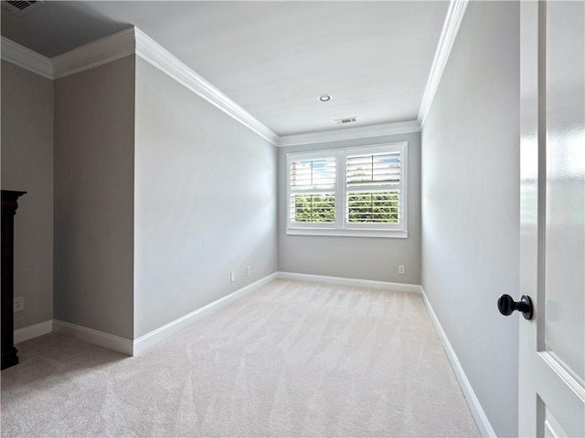 unfurnished room featuring visible vents, ornamental molding, carpet, and baseboards