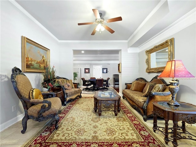 living room featuring crown molding, baseboards, and a ceiling fan