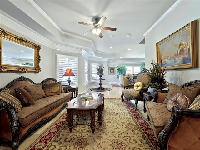 living room with crown molding and ceiling fan