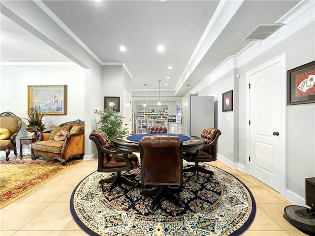 dining room featuring light tile patterned floors, baseboards, crown molding, and visible vents