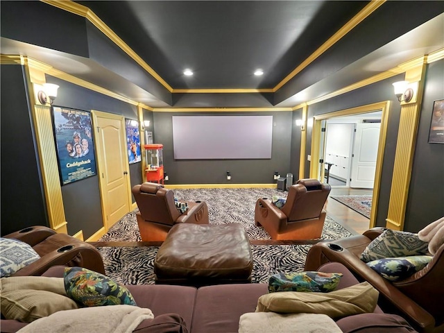 carpeted home theater with crown molding and baseboards