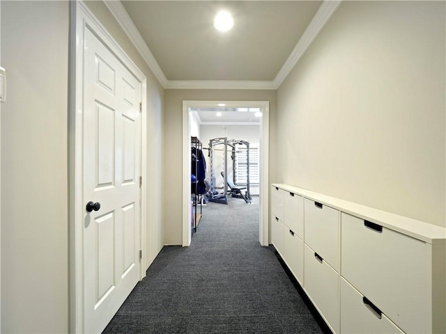 hall featuring crown molding and dark colored carpet