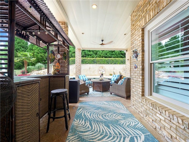 view of patio / terrace with ceiling fan and an outdoor hangout area
