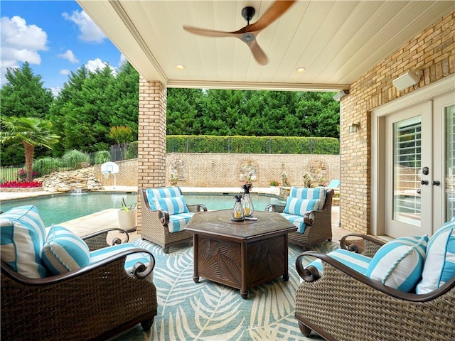 view of patio featuring an outdoor hangout area, ceiling fan, a fenced in pool, french doors, and fence private yard