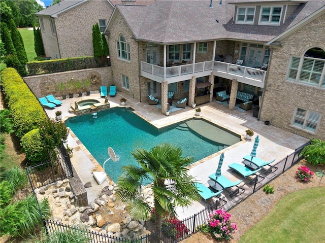 view of pool featuring a fenced backyard, a fenced in pool, an outdoor living space, a patio area, and an in ground hot tub