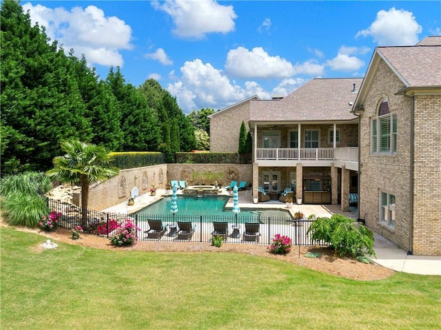 view of pool with a fenced backyard, a patio area, and a yard