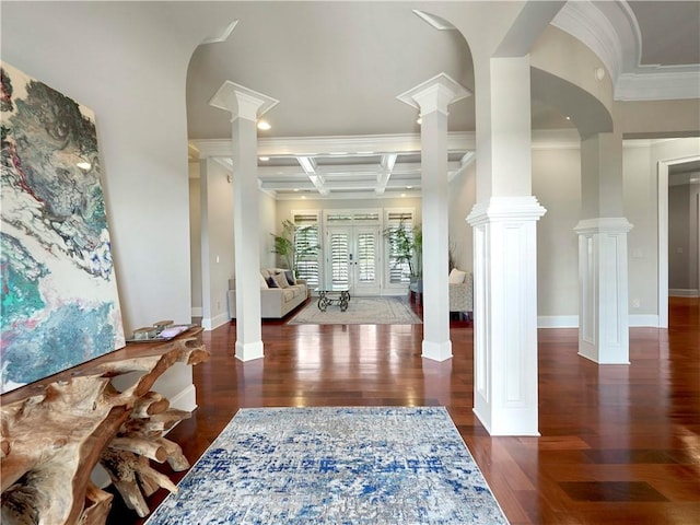 foyer entrance featuring crown molding, baseboards, decorative columns, wood finished floors, and coffered ceiling