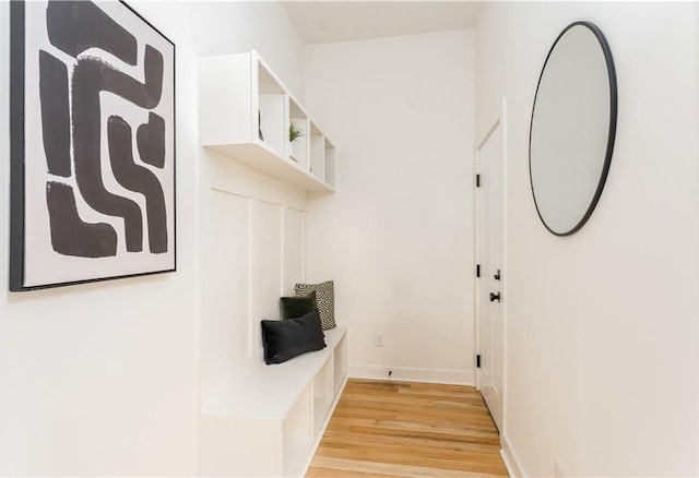 mudroom with baseboards and light wood-style floors