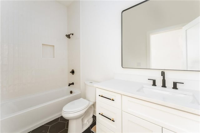 bathroom with shower / bath combination, vanity, tile patterned floors, and toilet