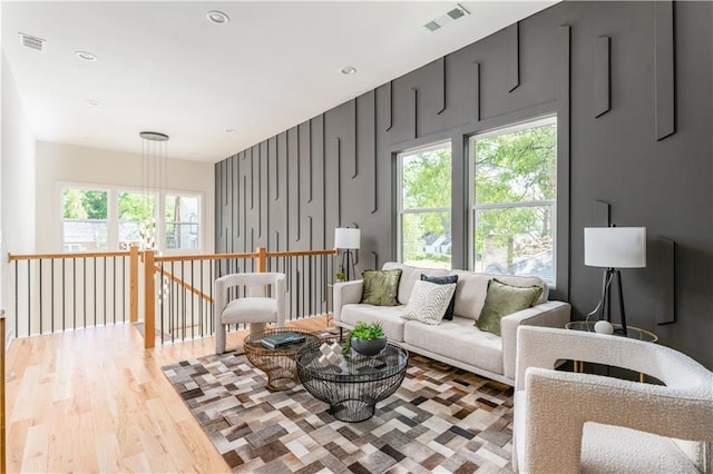 living area featuring wood finished floors, visible vents, and recessed lighting