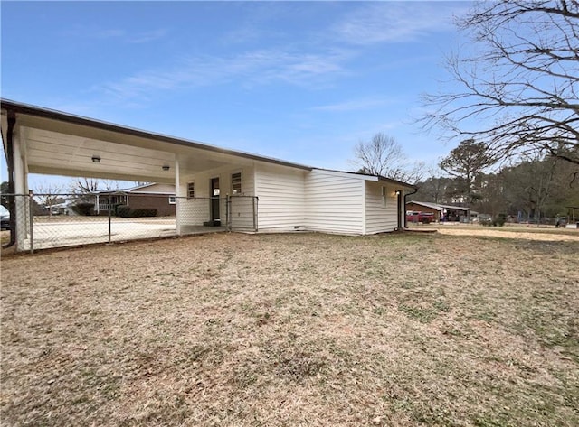 rear view of property featuring a carport