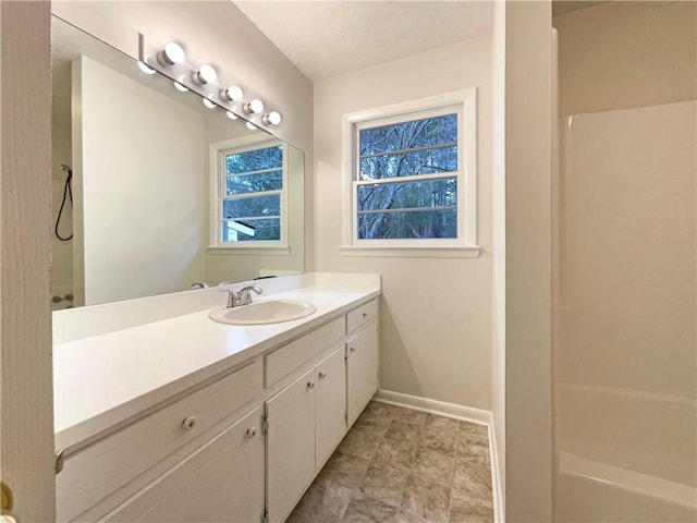 bathroom with vanity and walk in shower