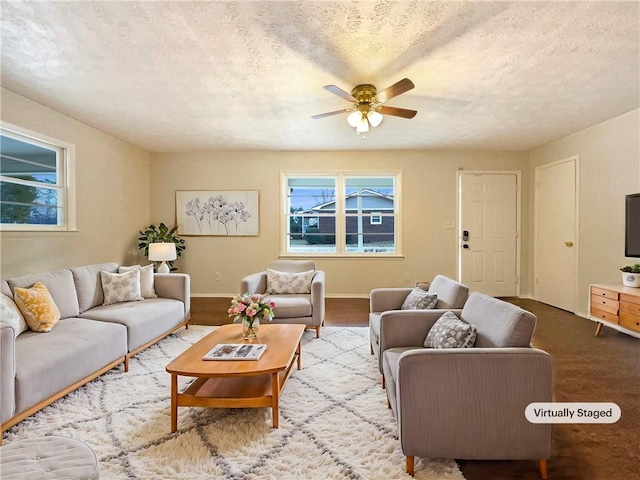 living room featuring a textured ceiling and a healthy amount of sunlight