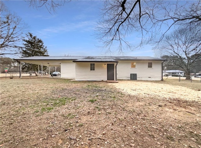 rear view of house featuring central AC unit