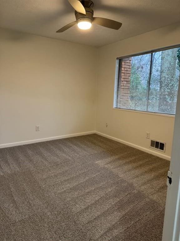 carpeted empty room with ceiling fan