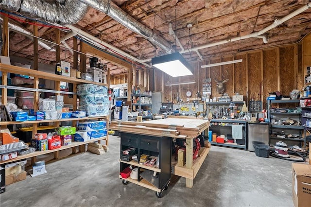 interior space with concrete flooring and a workshop area