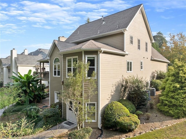 rear view of property with a garage