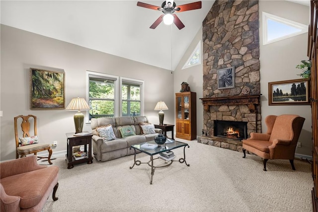 carpeted living room featuring a fireplace, high vaulted ceiling, and ceiling fan