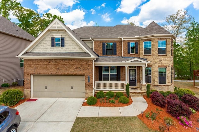 view of front of house featuring a garage, driveway, cooling unit, a porch, and brick siding