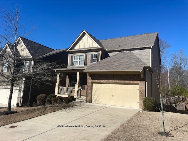 view of front of property featuring driveway, an attached garage, covered porch, board and batten siding, and brick siding