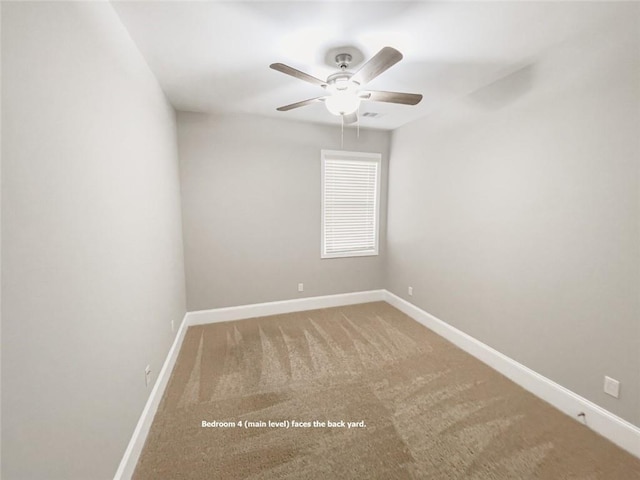 unfurnished room with a ceiling fan, baseboards, and carpet floors