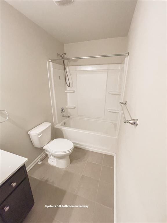 full bath with vanity, toilet, bathtub / shower combination, and baseboards