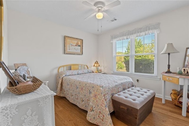 bedroom featuring ceiling fan and light hardwood / wood-style flooring