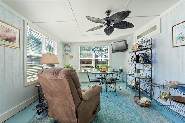 sunroom / solarium with ceiling fan and plenty of natural light