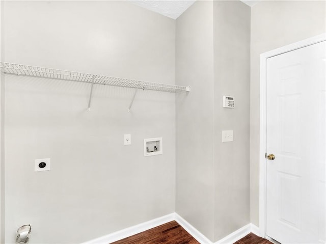 laundry area featuring electric dryer hookup, dark hardwood / wood-style floors, and hookup for a washing machine