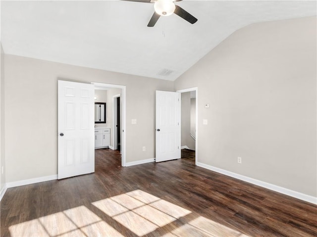 unfurnished bedroom with ceiling fan, dark hardwood / wood-style flooring, and vaulted ceiling