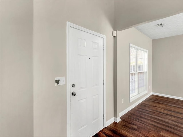 foyer with dark hardwood / wood-style flooring