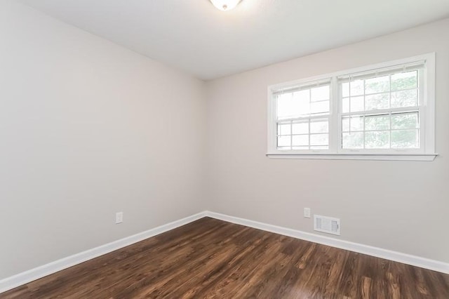 4820 Oak Grove Dr, Cumming, GA 30040 - unfurnished room with baseboards and dark wood-style floors