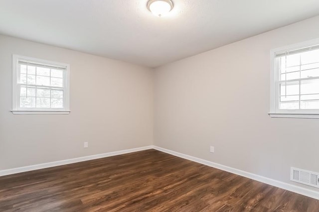 4820 Oak Grove Dr, Cumming, GA 30040 - empty room featuring baseboards and dark wood-type flooring